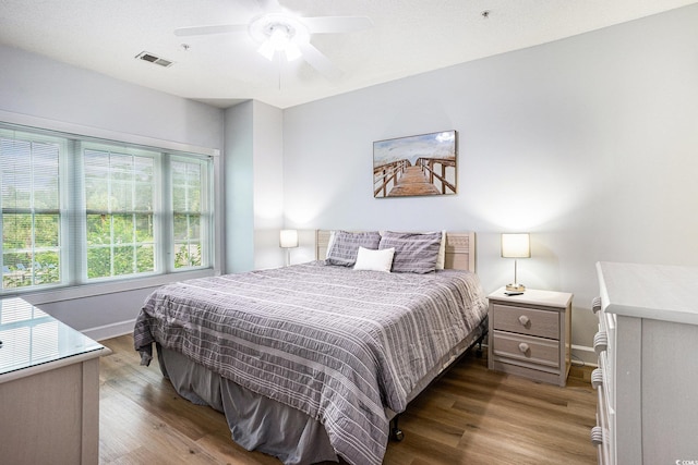 4868 Dahlia Ct Unit 202, Myrtle Beach, SC 29577 - bedroom with wood finished floors and ceiling fan