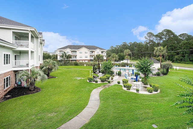 4868 Dahlia Ct Unit 202, Myrtle Beach, SC 29577 - view of green lawn with a community pool and a patio area