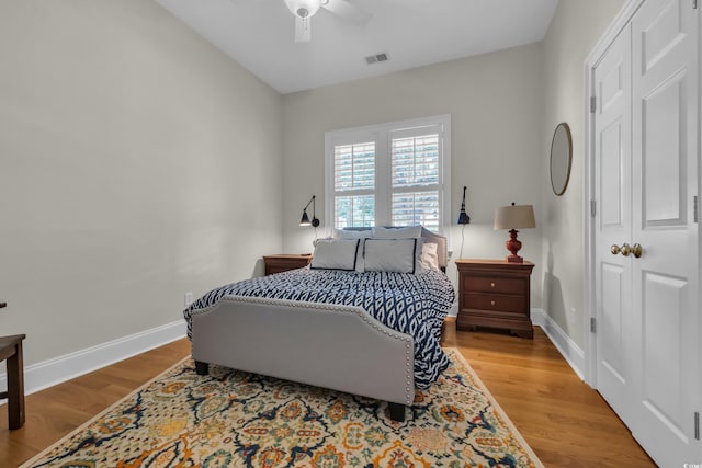 179 Cottage Ct, Pawleys Island, SC 29585 - bedroom with wood finished floors, a ceiling fan, and a closet