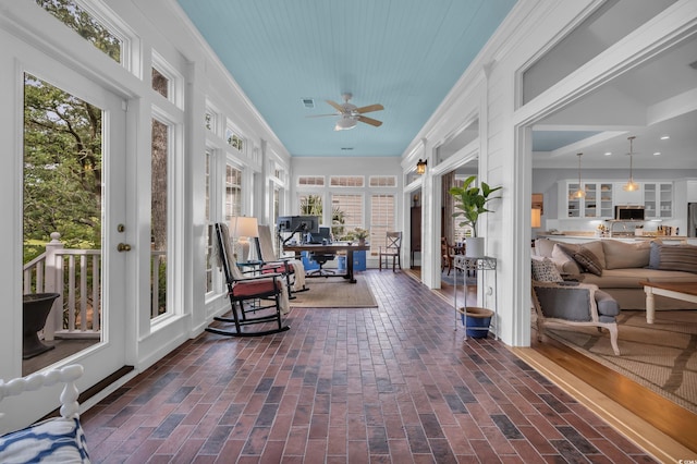 179 Cottage Ct, Pawleys Island, SC 29585 - sunroom / solarium with brick floors, healthy amount of natural light, and ornamental molding