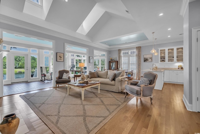 179 Cottage Ct, Pawleys Island, SC 29585 - living area with plenty of natural light, a high ceiling, a skylight, recessed lighting, and light wood-type flooring