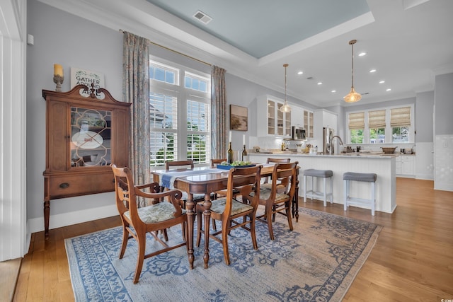 179 Cottage Ct, Pawleys Island, SC 29585 - dining space featuring recessed lighting, light wood-style floors, and crown molding