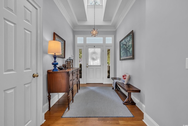 179 Cottage Ct, Pawleys Island, SC 29585 - entryway featuring wood finished floors, ornamental molding, and a chandelier