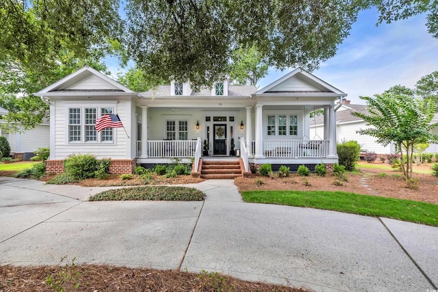 179 Cottage Ct, Pawleys Island, SC 29585 - view of front facade featuring covered porch