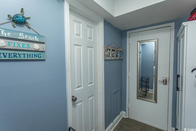 1207 S Ocean Blvd Unit 20403, Myrtle Beach, SC 29577 - hallway with dark wood finished floors and baseboards