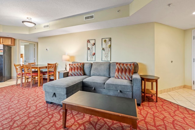 504 N Ocean Blvd Unit 1901, Myrtle Beach, SC 29577 - living room featuring light tile patterned flooring and a textured ceiling