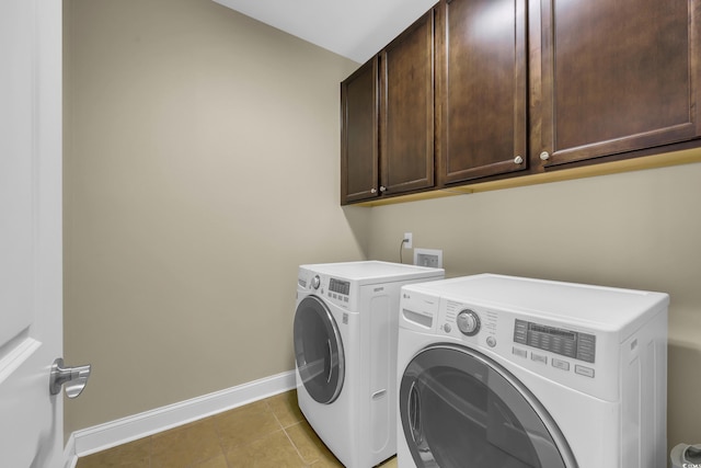 2199 Birchwood Cir, Myrtle Beach, SC 29577 - laundry area featuring cabinet space, washer and clothes dryer, and light tile patterned floors