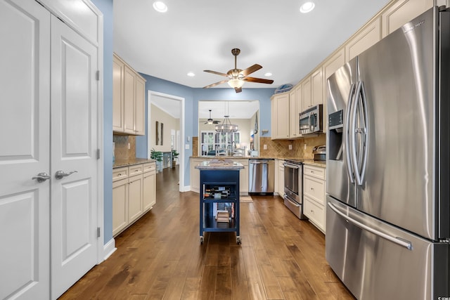 2199 Birchwood Cir, Myrtle Beach, SC 29577 - kitchen featuring appliances with stainless steel finishes, a ceiling fan, decorative backsplash, recessed lighting, and a peninsula