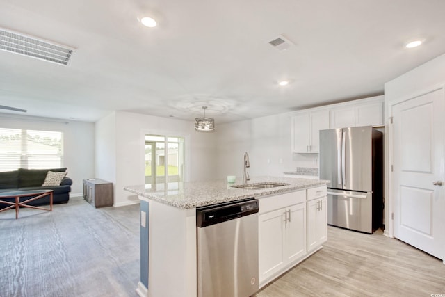 211 Seasons Trace Loop, Longs, SC 29568 - kitchen with appliances with stainless steel finishes, plenty of natural light, white cabinets, light wood-type flooring, and recessed lighting