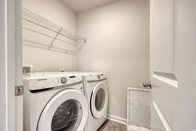 211 Seasons Trace Loop, Longs, SC 29568 - washroom with independent washer and dryer and wood finished floors