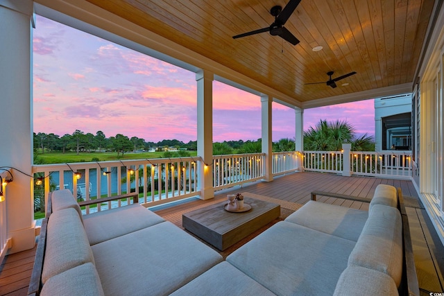 496 W Palm Dr, Myrtle Beach, SC 29579 - deck at dusk featuring ceiling fan and an outdoor living space