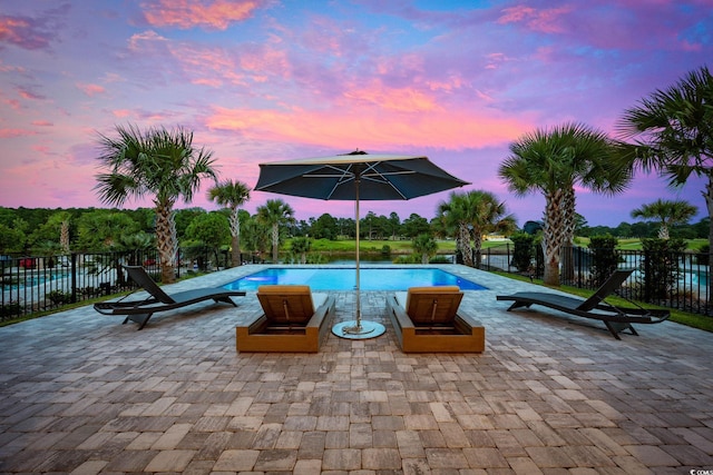 496 W Palm Dr, Myrtle Beach, SC 29579 - pool at dusk with a patio