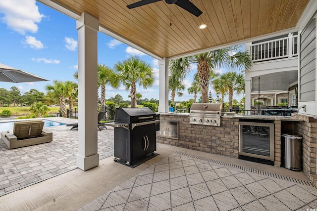 496 W Palm Dr, Myrtle Beach, SC 29579 - view of patio / terrace with an outdoor kitchen, a ceiling fan, and an outdoor pool