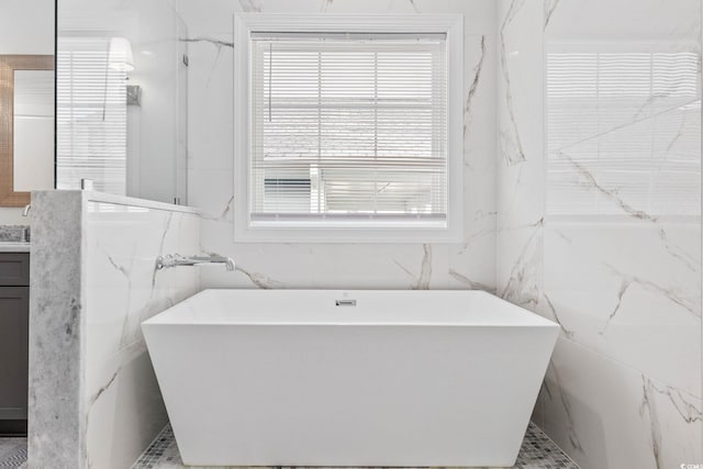 496 W Palm Dr, Myrtle Beach, SC 29579 - full bathroom with tile walls, vanity, healthy amount of natural light, and a soaking tub