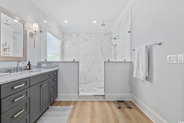 496 W Palm Dr, Myrtle Beach, SC 29579 - bathroom featuring vanity, a marble finish shower, wood finished floors, and crown molding