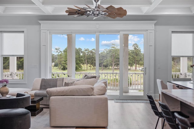 496 W Palm Dr, Myrtle Beach, SC 29579 - living area with coffered ceiling, beam ceiling, healthy amount of natural light, crown molding, and wood finished floors