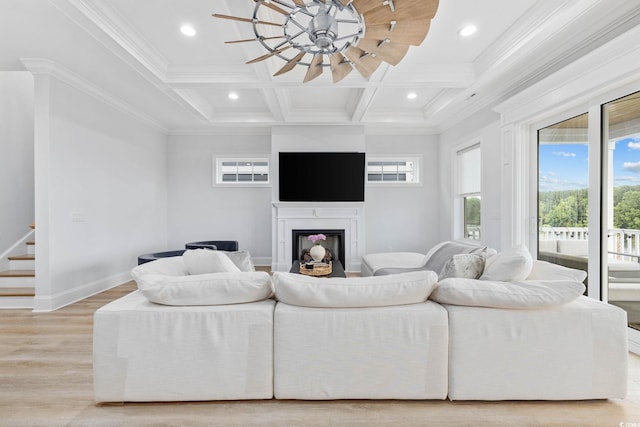 496 W Palm Dr, Myrtle Beach, SC 29579 - living room featuring a glass covered fireplace, beam ceiling, a ceiling fan, light wood-type flooring, and coffered ceiling
