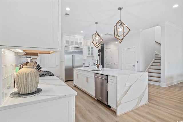 496 W Palm Dr, Myrtle Beach, SC 29579 - kitchen featuring stainless steel appliances, recessed lighting, light wood-style floors, white cabinetry, and glass insert cabinets