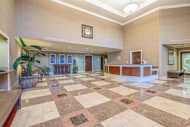 9994 Beach Club Dr Unit 1202, Myrtle Beach, SC 29572 - lobby featuring a high ceiling and crown molding