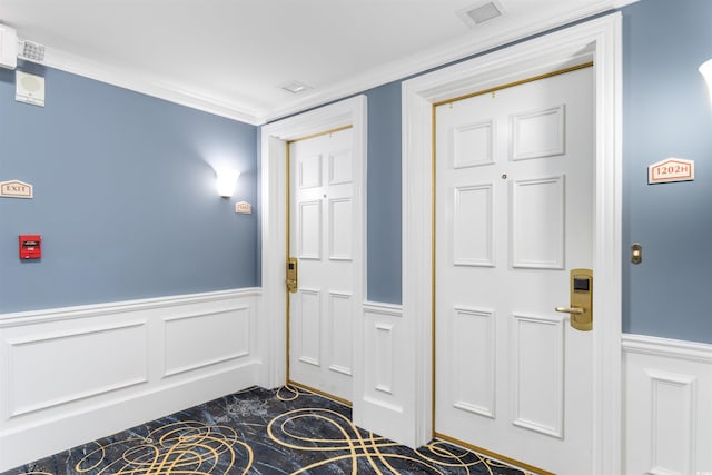 9994 Beach Club Dr Unit 1202, Myrtle Beach, SC 29572 - foyer with a wainscoted wall, a decorative wall, dark marble finish flooring, and ornamental molding