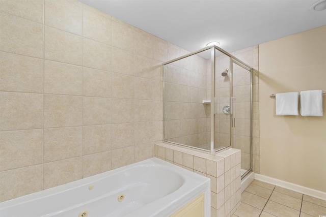 9994 Beach Club Dr Unit 1202, Myrtle Beach, SC 29572 - bathroom featuring tile patterned floors, a jetted tub, and a shower stall