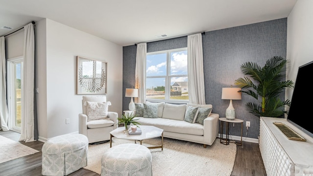 1407 Nokota Dr, Conway, SC 29526 - living room with wood finished floors, an accent wall, and wallpapered walls
