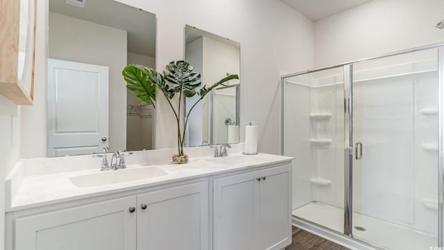 1407 Nokota Dr, Conway, SC 29526 - full bath with double vanity, a shower stall, and wood finished floors
