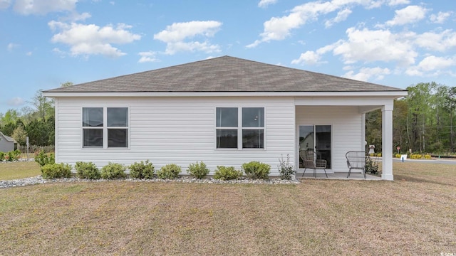 1407 Nokota Dr, Conway, SC 29526 - rear view of property featuring a patio, a yard, and roof with shingles