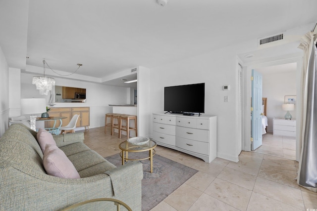 5511 N Ocean Blvd Unit 310, Myrtle Beach, SC 29577 - living area with a chandelier and light tile patterned floors