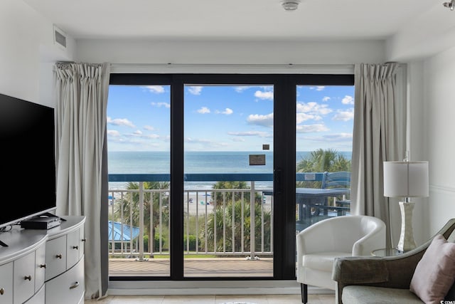 5511 N Ocean Blvd Unit 310, Myrtle Beach, SC 29577 - living area featuring a water view and light tile patterned floors