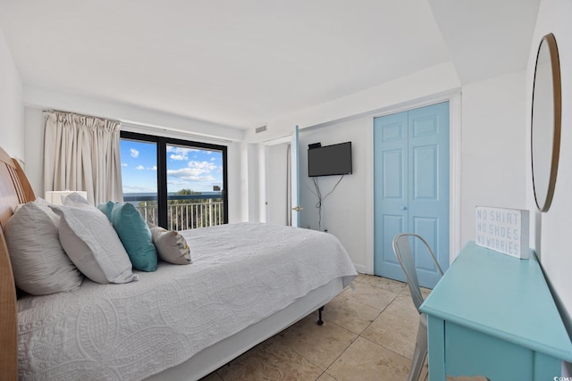 5511 N Ocean Blvd Unit 310, Myrtle Beach, SC 29577 - bedroom featuring access to exterior, a closet, and light tile patterned flooring