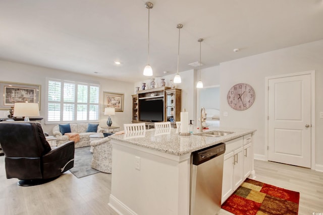 160 Juniata Loop, Little River, SC 29566 - kitchen featuring stainless steel dishwasher, light wood-style flooring, pendant lighting, and light stone counters
