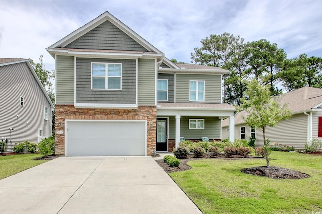 160 Juniata Loop, Little River, SC 29566 - craftsman inspired home with stone siding, driveway, an attached garage, a front yard, and covered porch