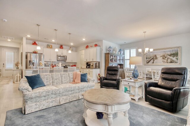 160 Juniata Loop, Little River, SC 29566 - living area with a chandelier, recessed lighting, and wood finished floors