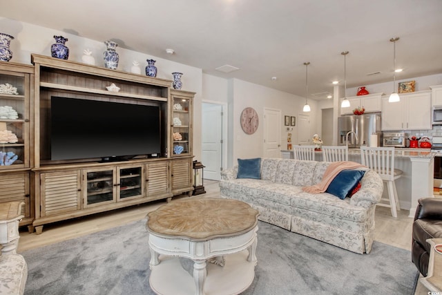 160 Juniata Loop, Little River, SC 29566 - living room featuring light wood-style flooring and recessed lighting