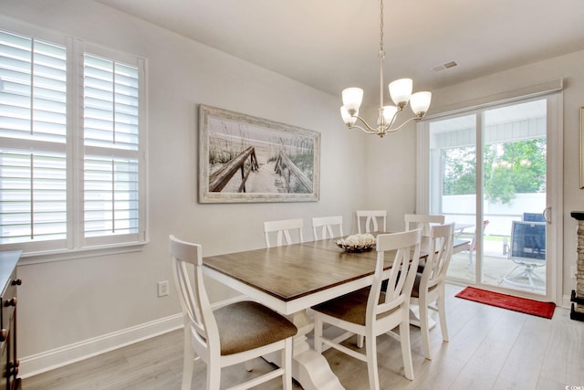 160 Juniata Loop, Little River, SC 29566 - dining area featuring light wood-style floors and a chandelier
