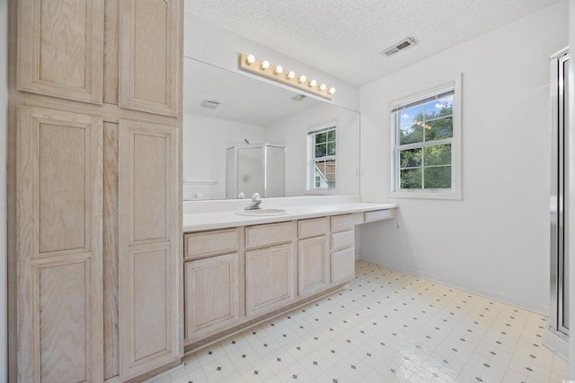 7288 Schooners Ct SW, Ocean Isle Beach, NC 28469 - full bath featuring a stall shower, vanity, tile patterned floors, and a textured ceiling