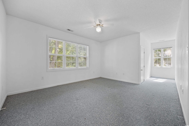 7288 Schooners Ct SW, Ocean Isle Beach, NC 28469 - empty room featuring carpet, a ceiling fan, and a textured ceiling