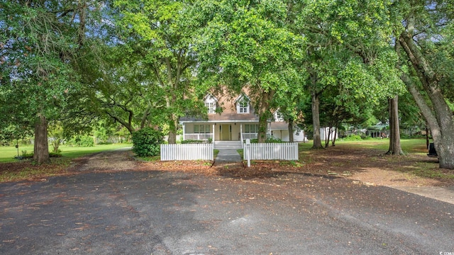 7288 Schooners Ct SW, Ocean Isle Beach, NC 28469 - obstructed view of property featuring covered porch