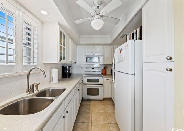 10200 Beach Club Dr Unit 16F, Myrtle Beach, SC 29572 - kitchen featuring white appliances, a raised ceiling, light countertops, healthy amount of natural light, and ornamental molding