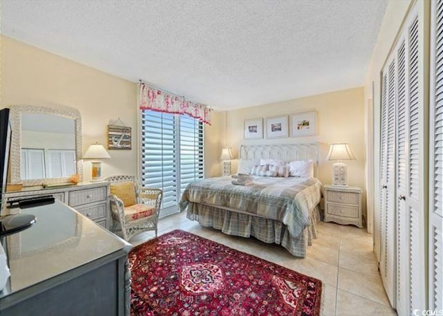 10200 Beach Club Dr Unit 16F, Myrtle Beach, SC 29572 - bedroom featuring light tile patterned flooring and a textured ceiling