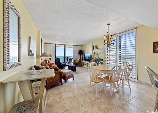 10200 Beach Club Dr Unit 16F, Myrtle Beach, SC 29572 - dining room with a textured ceiling, light tile patterned floors, a chandelier, and floor to ceiling windows