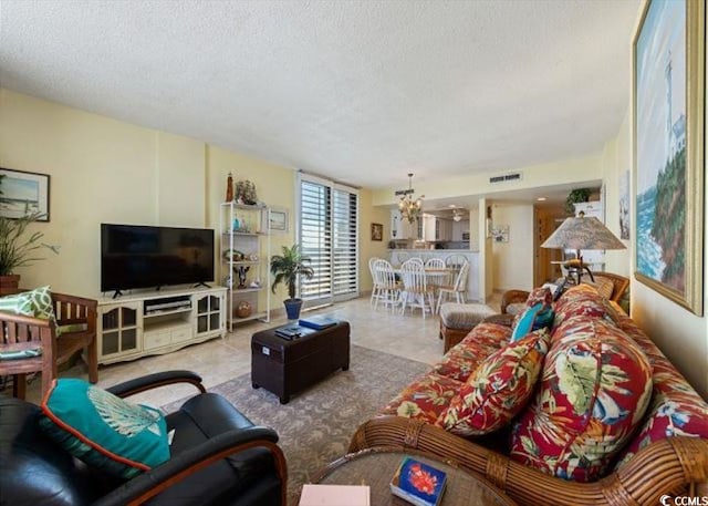 10200 Beach Club Dr Unit 16F, Myrtle Beach, SC 29572 - living area with a chandelier and a textured ceiling