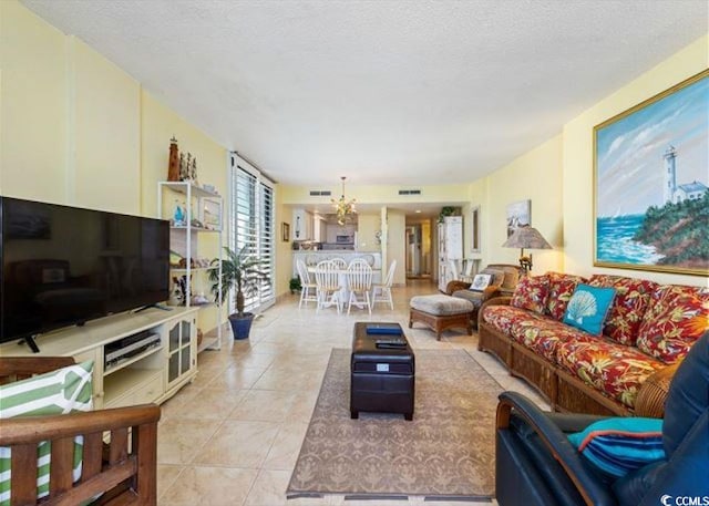10200 Beach Club Dr Unit 16F, Myrtle Beach, SC 29572 - living room with a chandelier, light tile patterned floors, and a textured ceiling