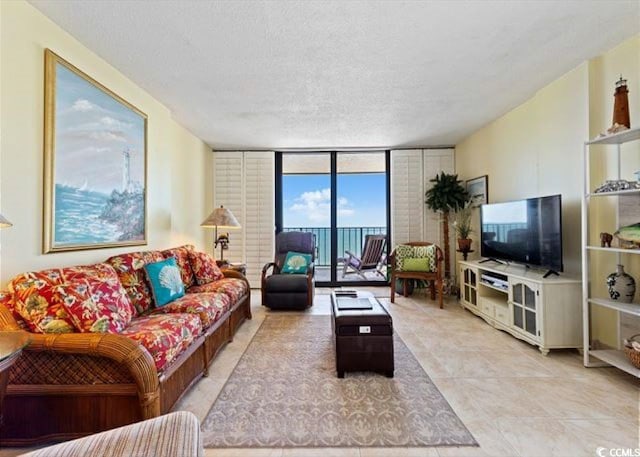 10200 Beach Club Dr Unit 16F, Myrtle Beach, SC 29572 - living area featuring floor to ceiling windows, a textured ceiling, and light tile patterned floors