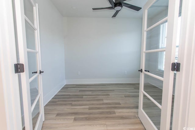 1514 Saw Palmetto St, North Myrtle Beach, SC 29582 - spare room with french doors, wood finished floors, and a ceiling fan