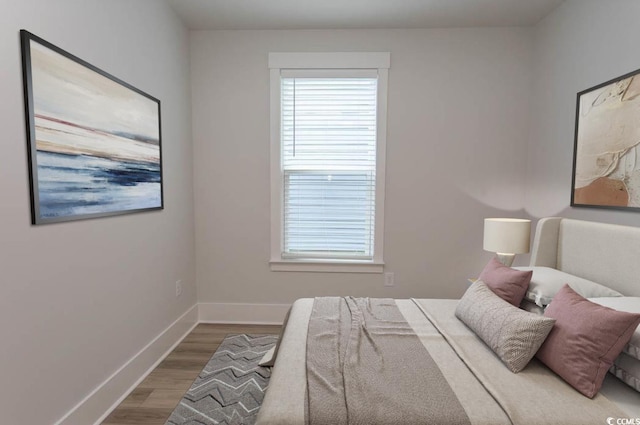 1514 Saw Palmetto St, North Myrtle Beach, SC 29582 - bedroom featuring wood finished floors and multiple windows