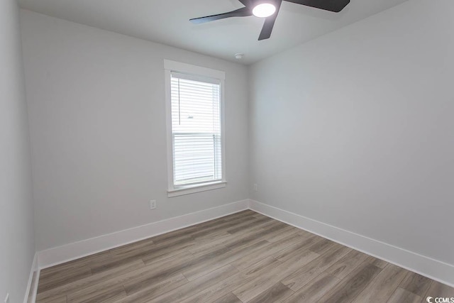 1514 Saw Palmetto St, North Myrtle Beach, SC 29582 - spare room with wood finished floors, healthy amount of natural light, and a ceiling fan