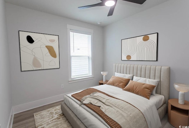 1514 Saw Palmetto St, North Myrtle Beach, SC 29582 - bedroom featuring multiple windows, wood finished floors, and a ceiling fan