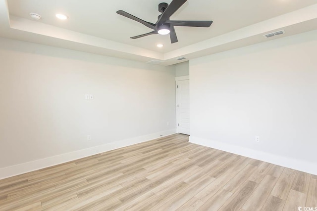 1514 Saw Palmetto St, North Myrtle Beach, SC 29582 - unfurnished room with recessed lighting, a ceiling fan, light wood finished floors, a tray ceiling, and a smoke detector